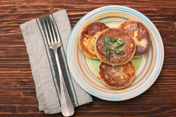 Cheese pancakes fried in a pan.