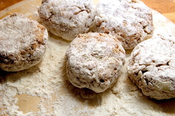 Rissoles, made from minced meat, onion and breadcrumbs, rolled in flour and ready to be fried