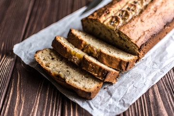 Homemade banana cake on a wooden background