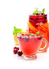 Red  fruit tea with lemon and cranberry isolated on white backgr