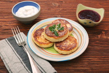 Cheese pancakes fried in a pan.