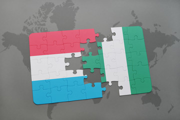 puzzle with the national flag of luxembourg and nigeria on a world map