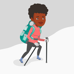 Young mountaneer climbing a snowy ridge.