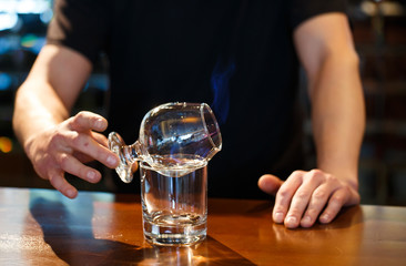 bartender burning Sambuca at the bar