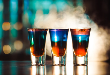 Multicolored shots on the bar