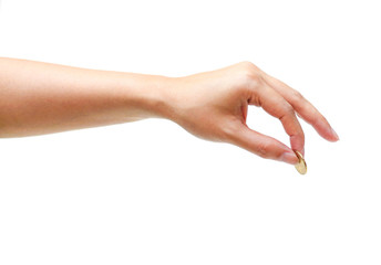 Female hand holding a golden coin