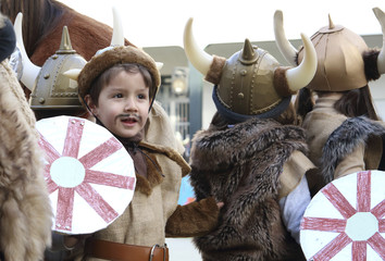 children with vikings costumes in a show in the school