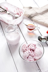 organic homemade ice cream in glass bowl on wooden background