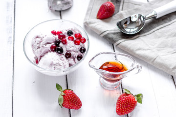 organic homemade ice cream in glass bowl on wooden background