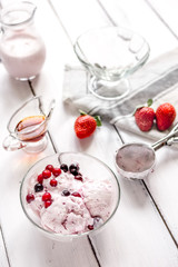 organic homemade ice cream in glass bowl on wooden background