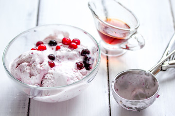 organic homemade ice cream in glass bowl on wooden background