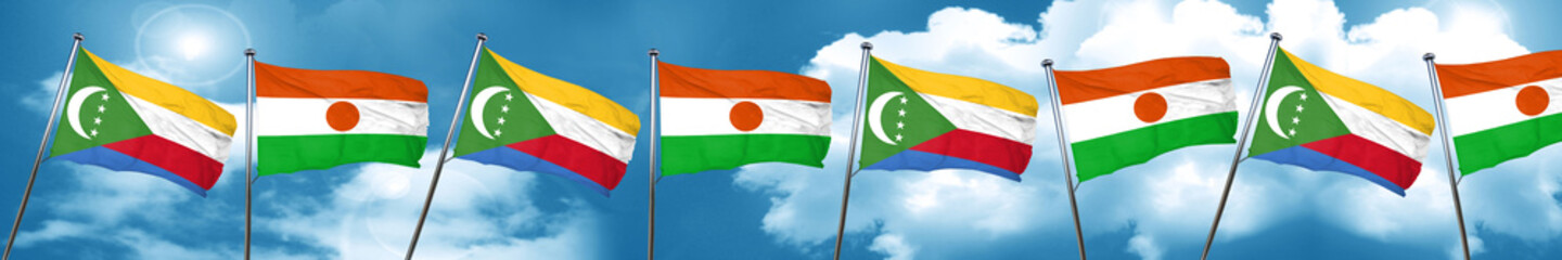 Comoros flag with Niger flag, 3D rendering