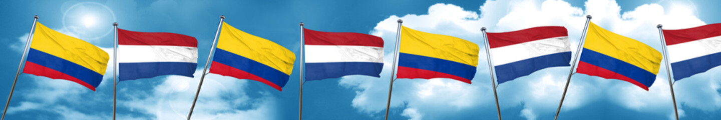 Colombia flag with Netherlands flag, 3D rendering