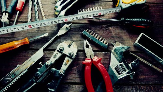 Many old rusty tools on repairman desk