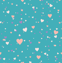 Seamless pattern hearts on a turquoise.