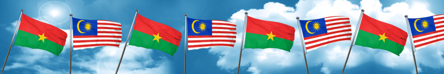 Burkina Faso flag with Malaysia flag, 3D rendering