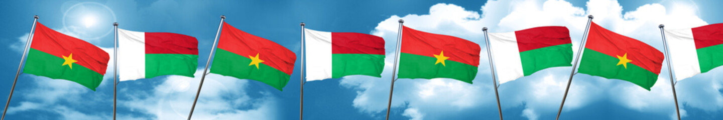 Burkina Faso flag with Madagascar flag, 3D rendering