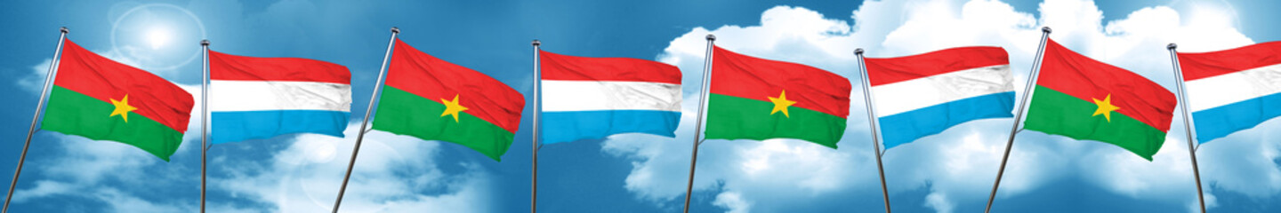 Burkina Faso flag with Luxembourg flag, 3D rendering