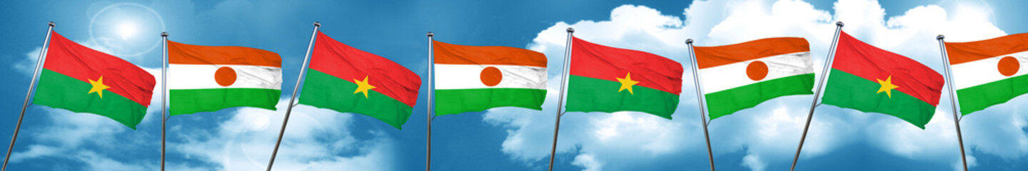 Fototapeta na wymiar Burkina Faso flag with Niger flag, 3D rendering