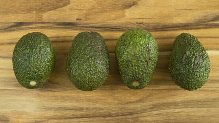 Avocados in center facing opposite directions