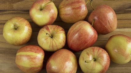 Overhead view of apples on wood table