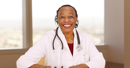 Senior African doctor smiling at camera