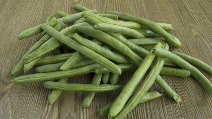 Pile of Green Beans on wood table