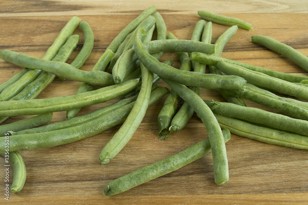 Wall mural green beans on wood table