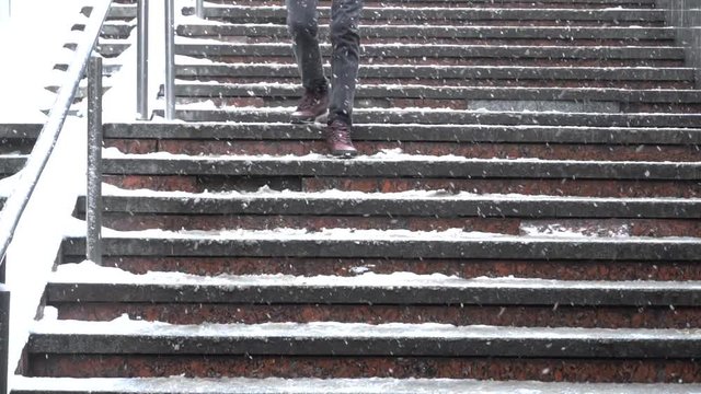 People Walking on Stairs Under the Snow