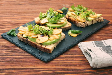 Avocado sandwich with mushroom and greens