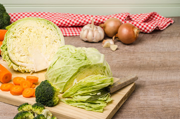 Fresh vegetables from the garden, carrots, cabbage, broccoli, on wooden table