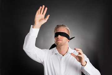 Young Blindfolded Businessman