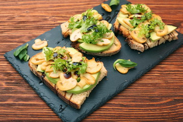 Avocado sandwich with mushroom and greens
