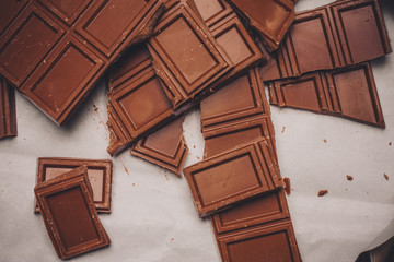 broken chocolate tiles on a light background