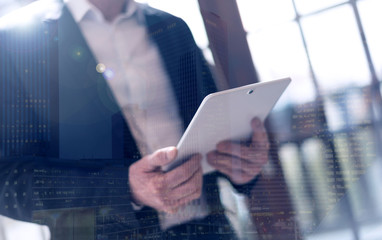 Businessman with tablet, light effect, double exposure