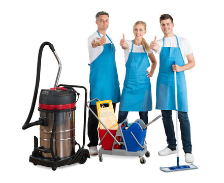 Group Of Janitors With Their Cleaning Equipment