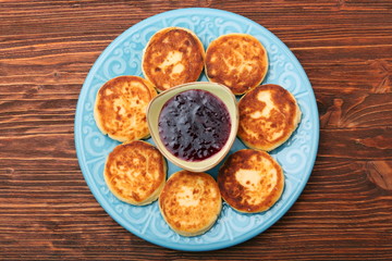 Cheese pancakes fried in a pan.