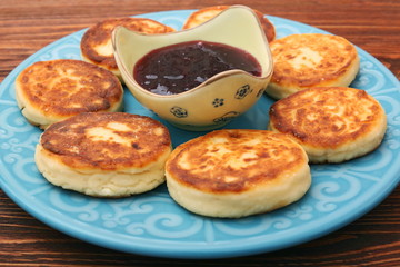 Cheese pancakes fried in a pan.