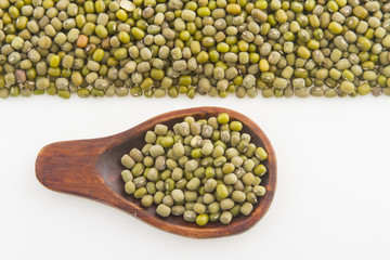 Mung bean on wood and isolated on white background
