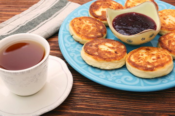 Cheese pancakes fried in a pan.