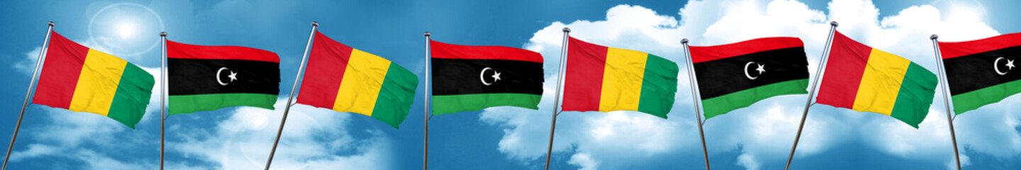Guinea flag with Libya flag, 3D rendering