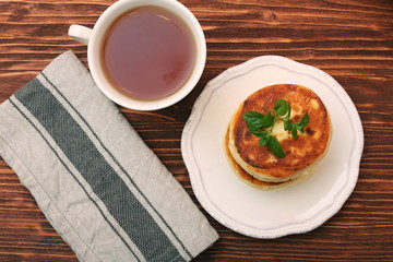 Cheese pancakes fried in a pan.