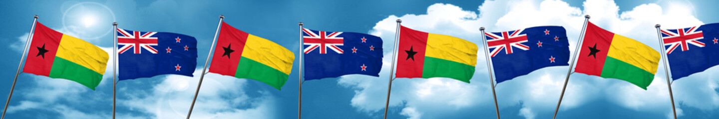 Guinea bissau flag with New Zealand flag, 3D rendering
