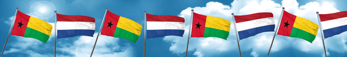 Guinea bissau flag with Netherlands flag, 3D rendering