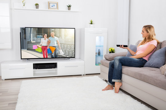 Woman Watching Television At Home