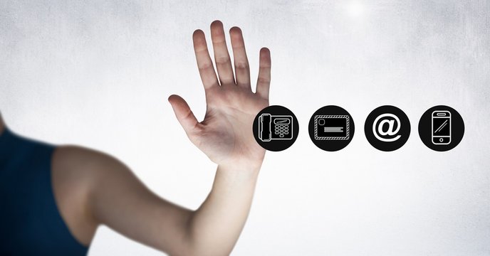 Close-up of hand beside communication icon set