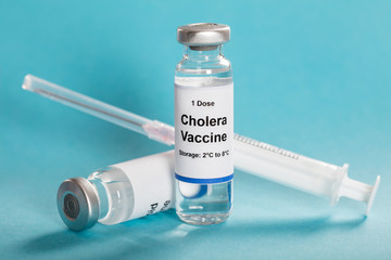 Cholera Vaccine In Vial With Syringe - obrazy, fototapety, plakaty