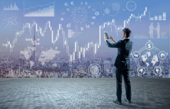 young businessman holding tablet PC and financial technology concept, FinTech, Block Chain, abstract image visual