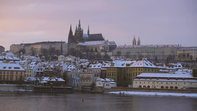 View of Charles Bridge and Castle in Prague Under the Snow in Winter
