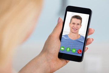 Woman Videoconferencing On Mobilephone